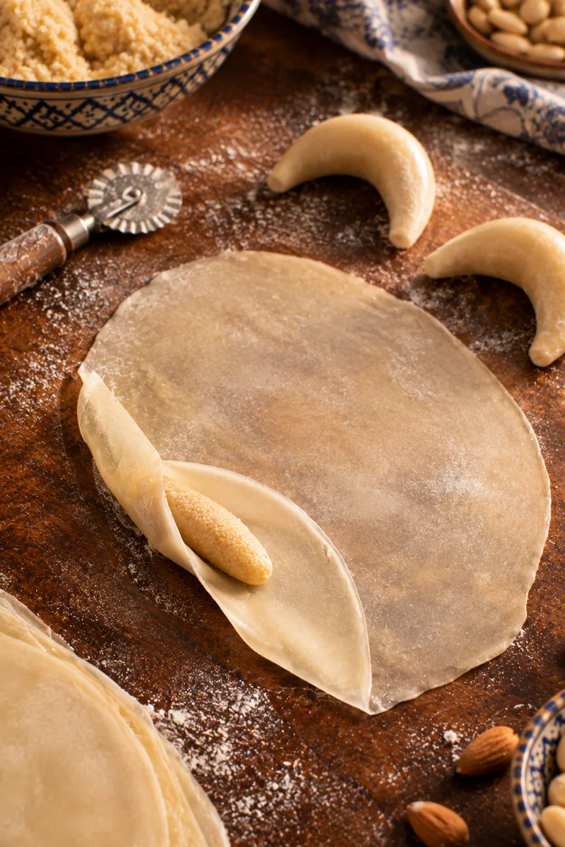 Dough rolled paper thin, wrapped around an almond finger and bent into a crescent